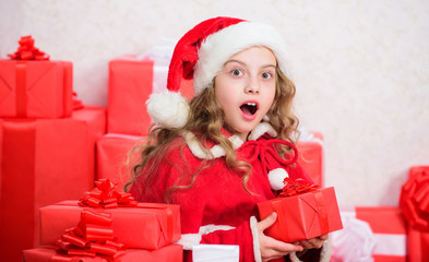 Girl celebrate christmas. Santa bring her gift. Winter happiness concept. Explore christmas gifts. Unpacking christmas gift. New year holiday tradition. Kid excited about opening christmas present