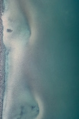 Dark ocean. Sand on the bottom. Fading. Background.