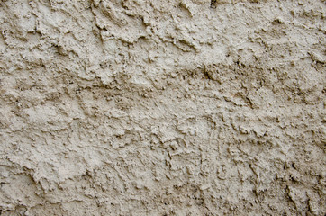 Cement plaster fur coat. Street plaster on the wall. Texture, large bumps. Gray empty background. Decoration of facades of buildings.