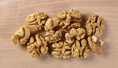 Walnut kernels on cutting board  background and texture