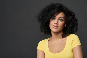 Happy woman looking at camera smiling