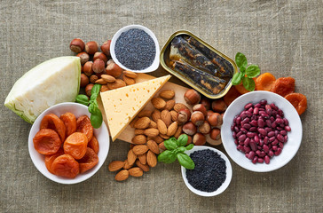 Various products rich in calcium on a brown background 