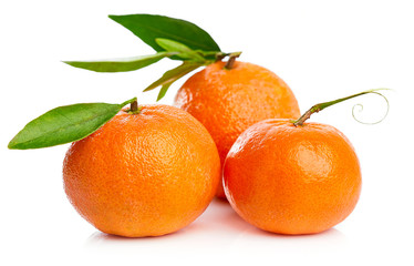 Ripe tangerines with green leaf for design packing. Fruity still life citrus. Isolated on white background.