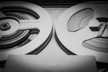 an old reel-to-reel tape recorder and gramophone in a thick layer of dust, the front and back...