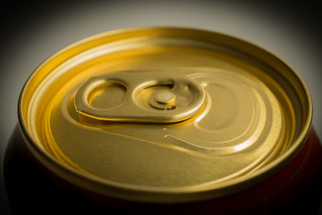 Close-up of the top of aluminum can for soft drinks or beer with still closed cap. side shot
