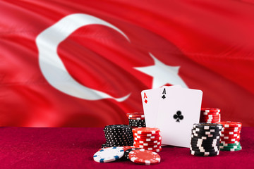 Turkey casino theme. Aces in poker game, cards and chips on red table with national flag background. Gambling and betting.