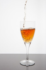 Fruit Juice filling from bottle to glass