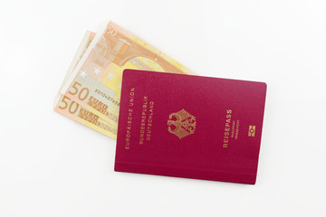 German passport and euro banknotes isolated on white background