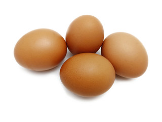 Raw fresh brown chicken eggs isolated on white background.