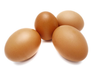 Raw fresh brown chicken eggs isolated on white background.