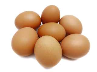 Raw fresh brown chicken eggs isolated on white background.