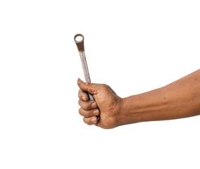 The hand of the mechanic is holding an old wrench isolated