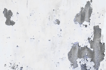 Abstract texture of old white wall with peeled off paint. Beautiful, artistic, creative background.White rough weathered stone texture. Copy space
