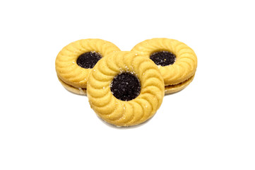 Biscuit sandwich butter cookies with cream and Blueberry flavoured jam. A stack of crunchy delicious sweet meal and useful cracker. isolated on white background. Soft focus.
