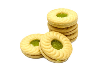 Naklejka na ściany i meble Biscuit sandwich butter cookies with cream and Kiwi&Apple flavoured jam. A stack of crunchy delicious sweet meal and useful cracker. isolated on white background. Soft focus.