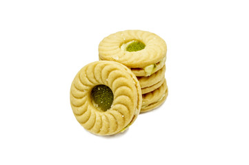 Naklejka na ściany i meble Biscuit sandwich butter cookies with cream and Kiwi&Apple flavoured jam. A stack of crunchy delicious sweet meal and useful cracker. isolated on white background. Soft focus.