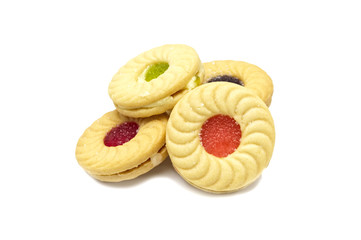 Biscuit sandwich butter cookies with cream and mixed fruits flavoured jam. A stack of crunchy delicious sweet meal and useful cracker. isolated on white background. Soft focus.