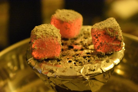 Glowing coal on a shisha pipe