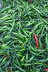 red chili peppers on a wooden background