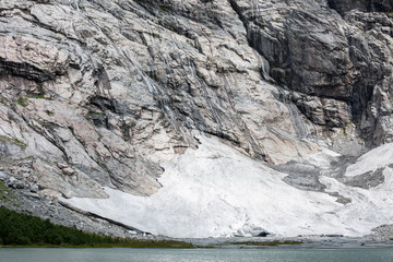 Eisfeld mit Höhle und Gletschersee unterhalb des Boyabreen Gletschers im Jostedalsbreen...