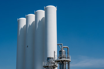White Concrete Tank Silo industry with Blue sky