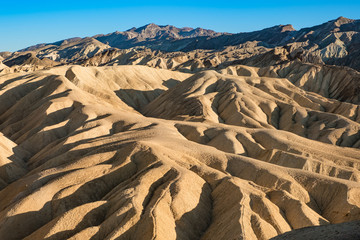 Fototapeta na wymiar Zabriski Point Mudstones form Badlands Death Valley National Park California