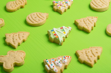 confectionery, cookies, neatly laid out, in the form of a Christmas tree, snowman, on a light green background