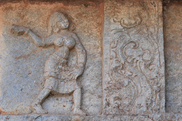 Dancing girl and beautiful design Carved in the stone, on the wall of Mahanavami dibba, Hampi , Karnataka, INDIA