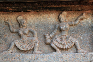 Dancing girl and beautiful design Carved in the stone, on the wall of Mahanavami dibba, Hampi , Karnataka, INDIA