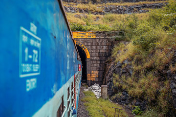India, Maharashtra prospective image of Indian train which going to the tunel trough the mountain,...