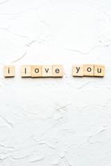 inscription i love you on white wooden background.concept