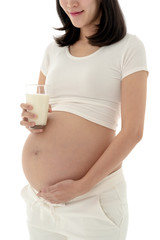 Asian Pregnant Woman Standing Holding a Glass of Milk