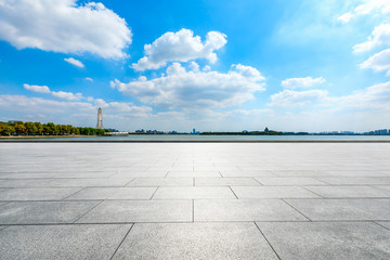 Empty square floor and Suzhou city skyline on a sunny day.