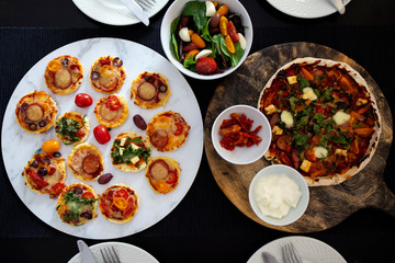 Home made pizza and mini pizza on the table