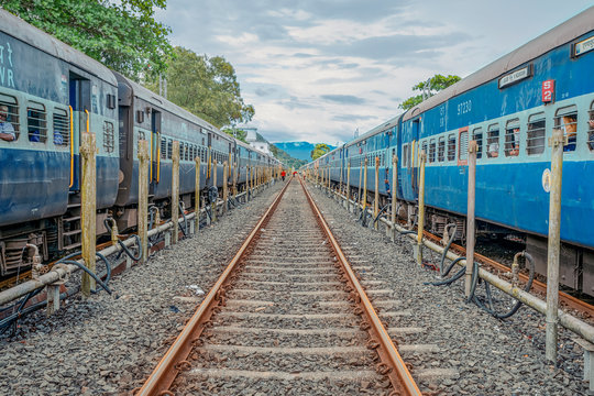 20/10/2019 India, Maharashtra prospective image of two Indian train with rail between them with gloomy sky. Train to GOA. overpopulation concept