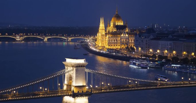 Beautiful aerial panorama of Budapest night lights of Parliament and Chain Bridge mirrored in Danube river