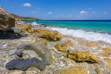 Rocks and stones on beach with sea