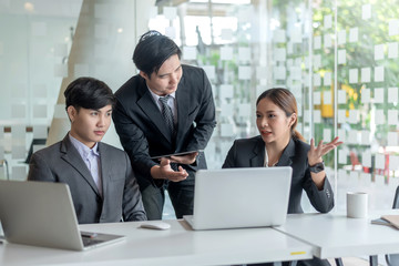 Young asian business group with the creative work, talk and exchange ideas shared at the meeting.