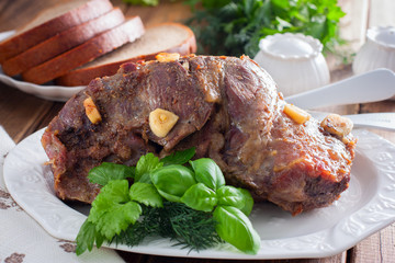 Baked beef filet whole piece on a wooden table, horizontal