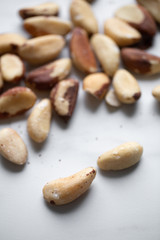 Brazil nuts on white marble background