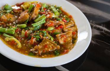 Stir fried pork and basil on table background, Thai food