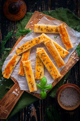 Salty cookies with caraway seeds on a wooden board, selective focus, top view