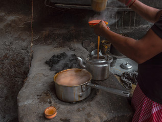 Streetside Indian style Hot Milk tea or Chai with clay tea cup . Selective Focus is used.
