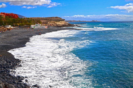 View on Atlantic ocean and Playa de la Enramada beach with black volcanic sand on the south of Tenerife,Canary Islands,Spain.Travel or vacation concept.Selective focus.