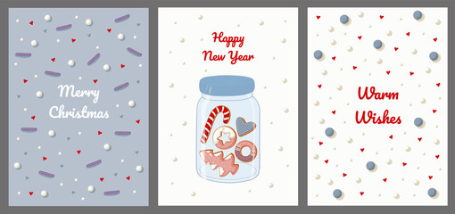 Postcards with sweet topping, hearts, snow, gingerbread cookies in a glass jar.