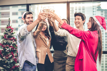 Group of office workers celebrating party with drink wine with happy.