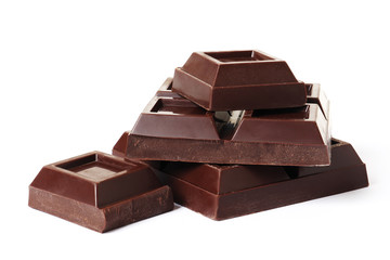 Dark chocolate pieces on white background