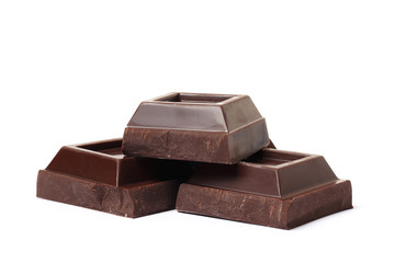Dark chocolate pieces on white background