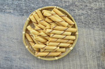 Vanilla waffle roll sticks in bamboo basket