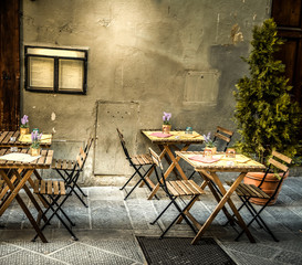Tables and chiars in a picturesque corner in Florence